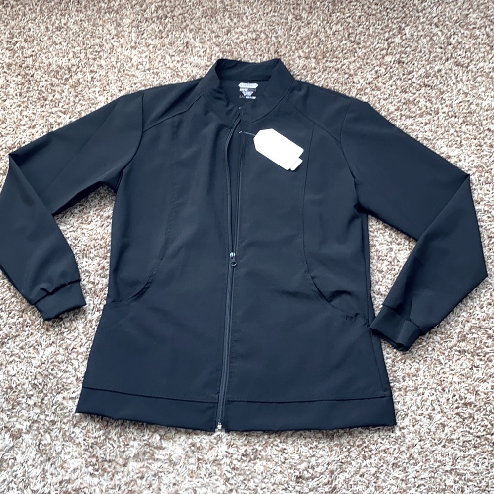 Scrubaid nursing scrub uniform jacket.